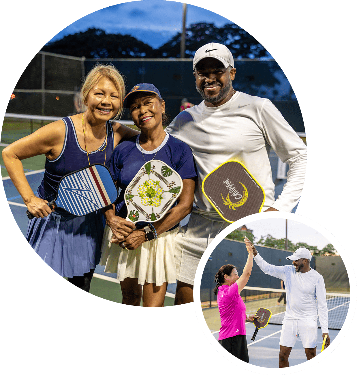 Two women and a man posing with tennis rackets and awards on a tennis court.